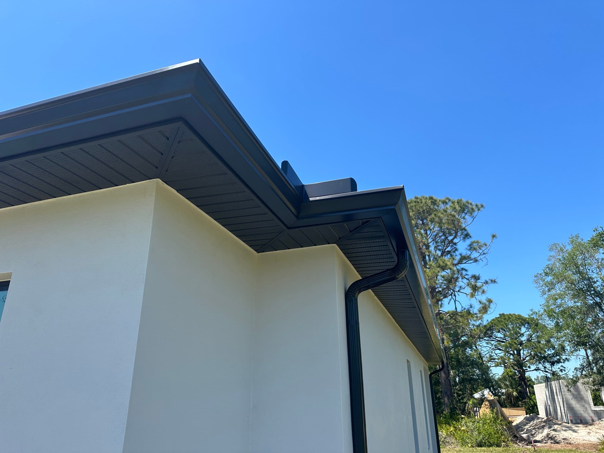 New seamless gutter installation with downspout extensions in Englewood FL